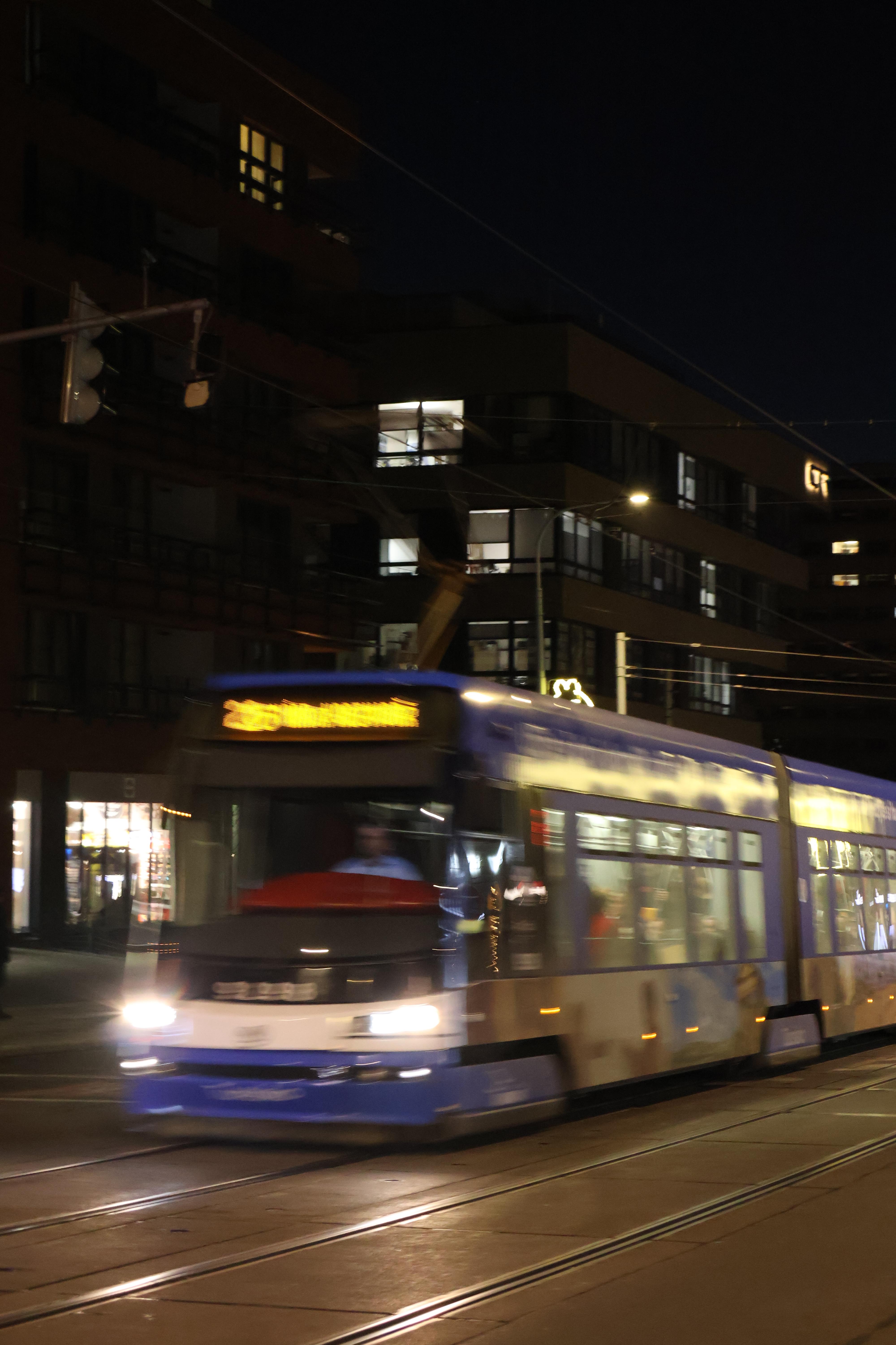 A tram at night.